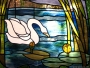 Art glazing of the door with the swan motif