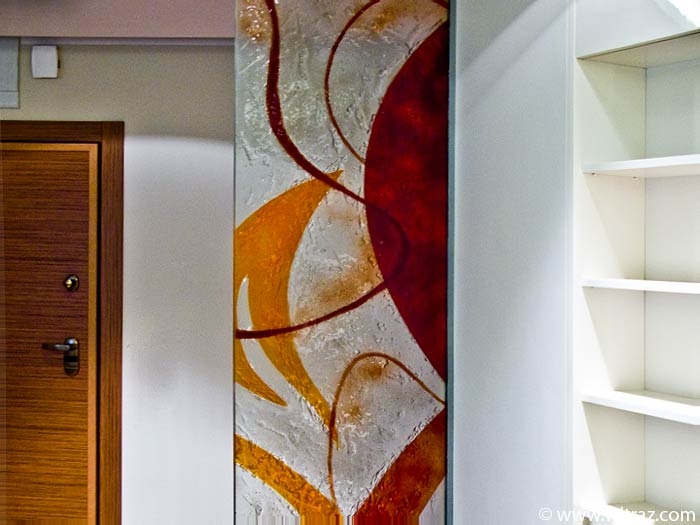 Art glass partition wall in orange and red