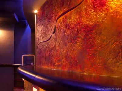 Curved colored glass panel in a night club