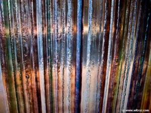 Bent coloured art glass wall