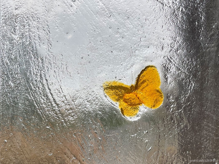 Art glass floral headstone with butterfly