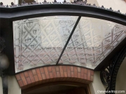 Bent sandblasted art glass canopy