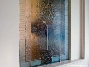 The wall - colourless art glass partition with the orange tree motif