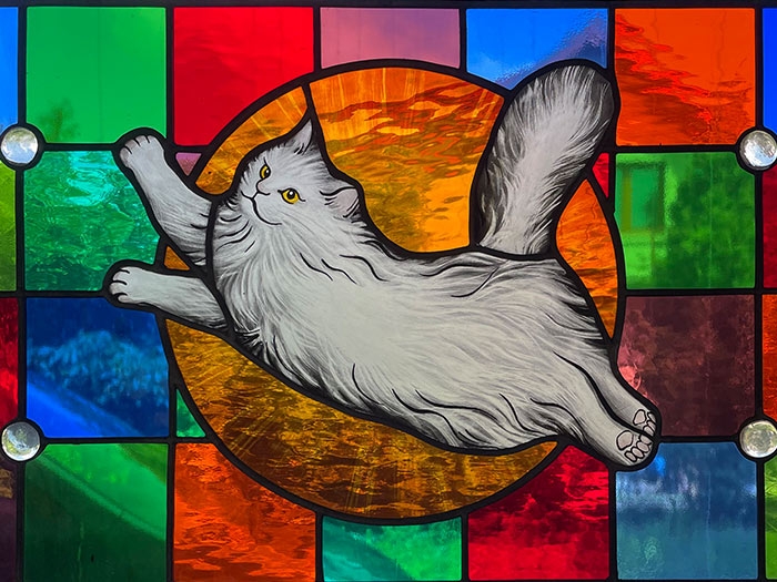 Stained glass transom with cat