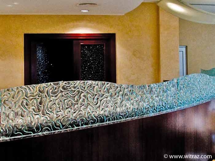 Colourless bent art glass decorates the furniture of the Cracow Holiday Inn hotel
