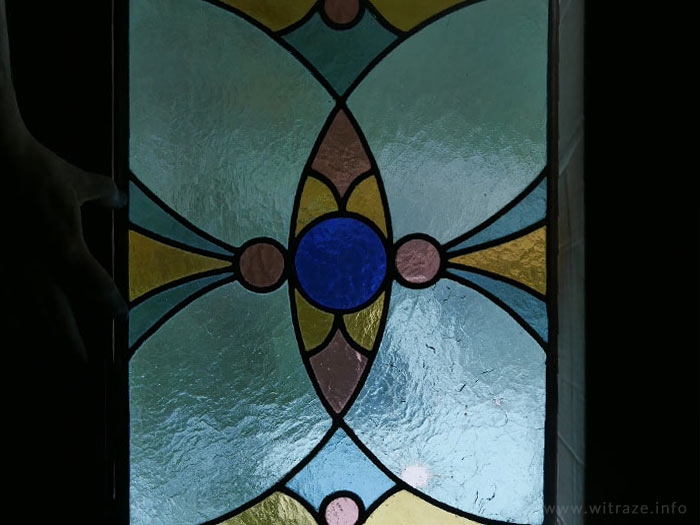 Stained glass with the bullet hole from Warsaw Upraising