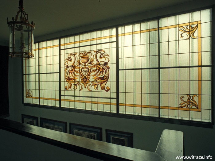 Stained glass with the painted decoration in the residence windows