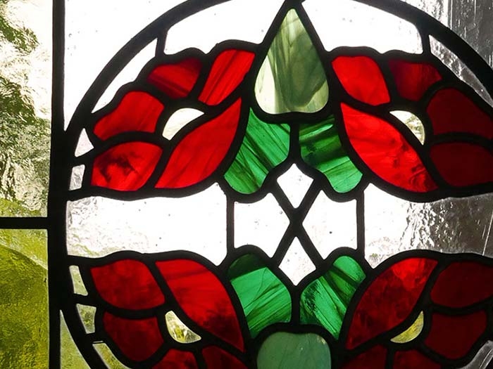Stained glass door with red flowers